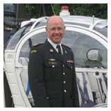 Carlos posing in front of an Alouette 2 helicopter